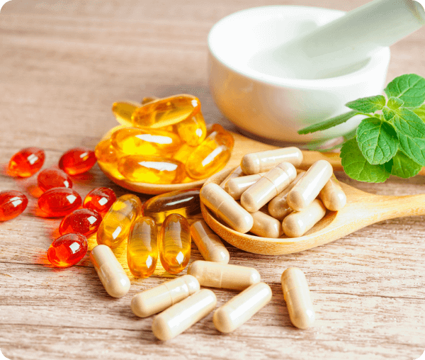 Supplement capsules a Curated natural product offerings from a Southern California broker.nd pills on wooden surface